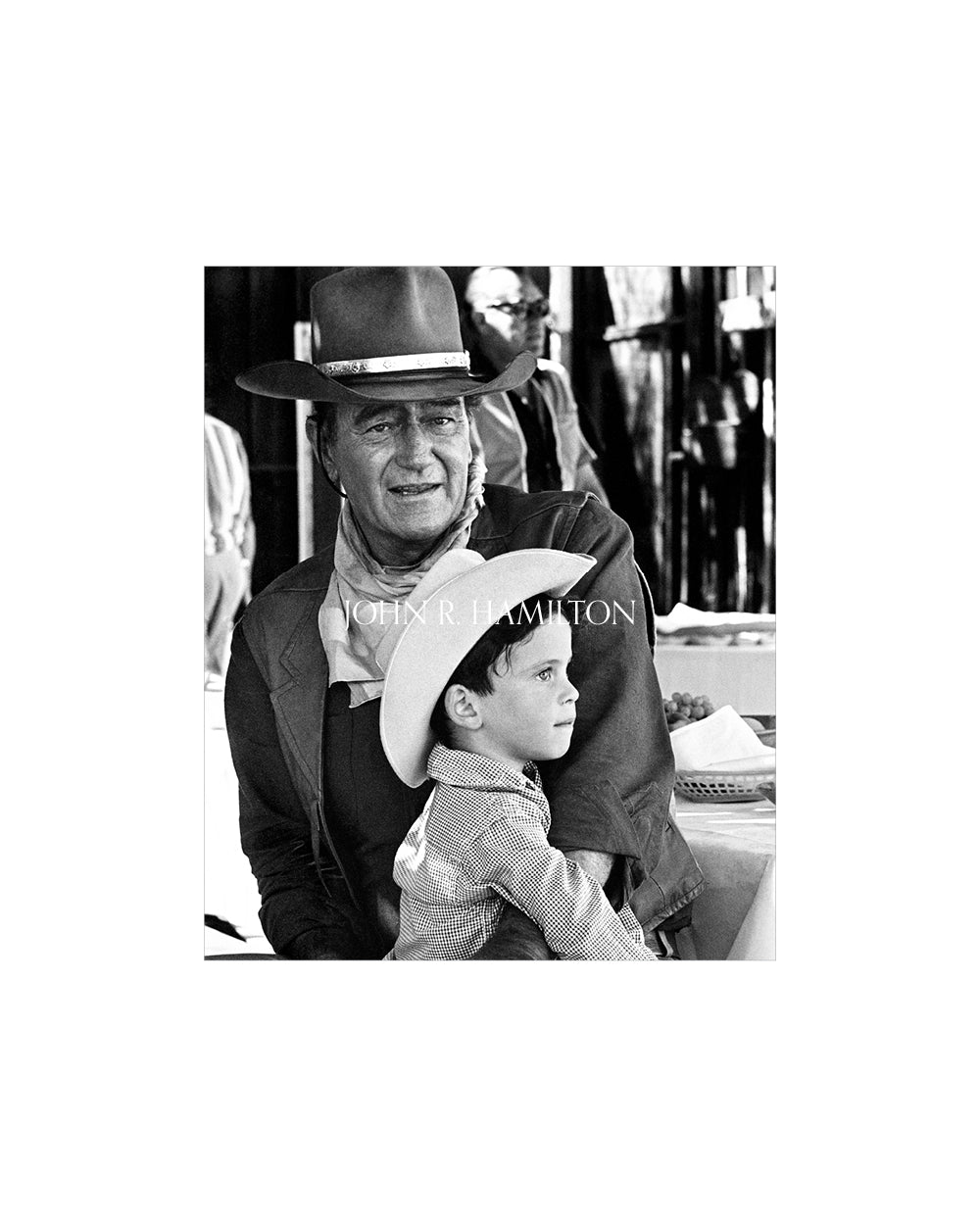 JOHN WAYNE AND SON ETHAN ON THE SET OF "EL DORADO", 1966