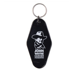 black keychain in diamond shape with john waynes face and "john wayne cancer foundation" below it 