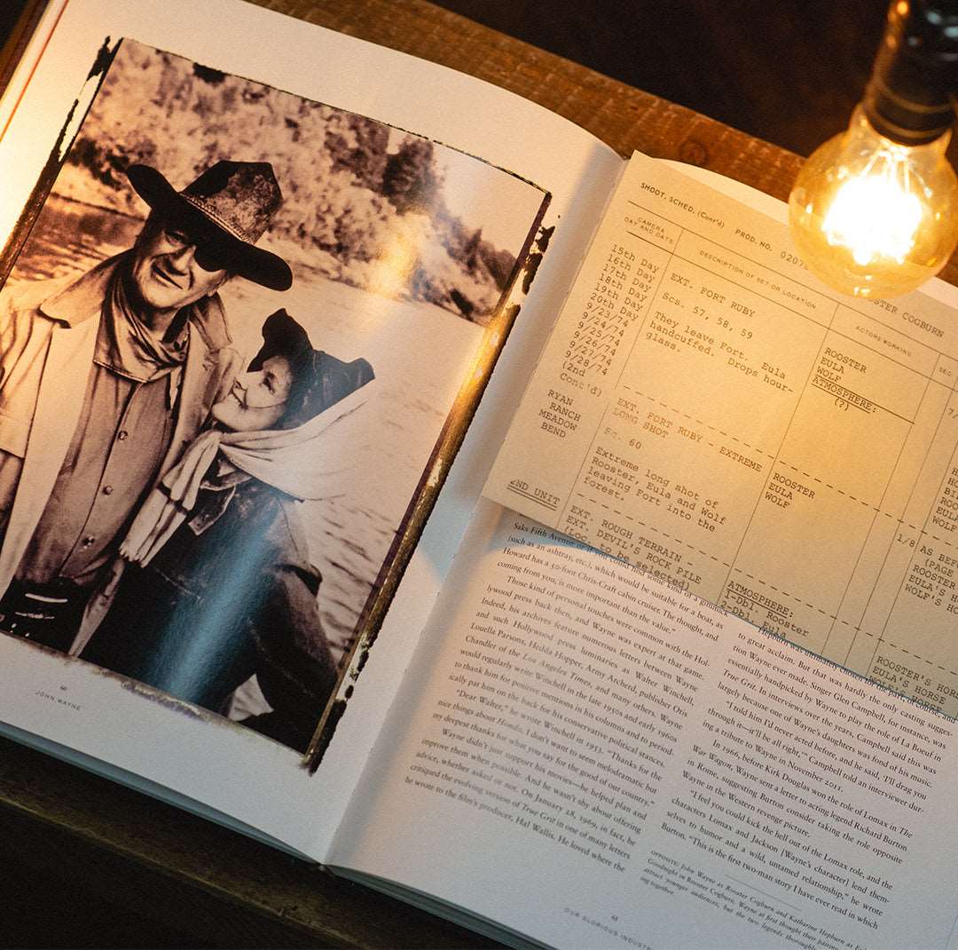 book opened to a picture of a man and woman with texts on the pages
