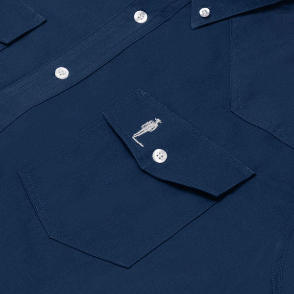 close up of john wayne silhouette on cobalt blue chest pocket 