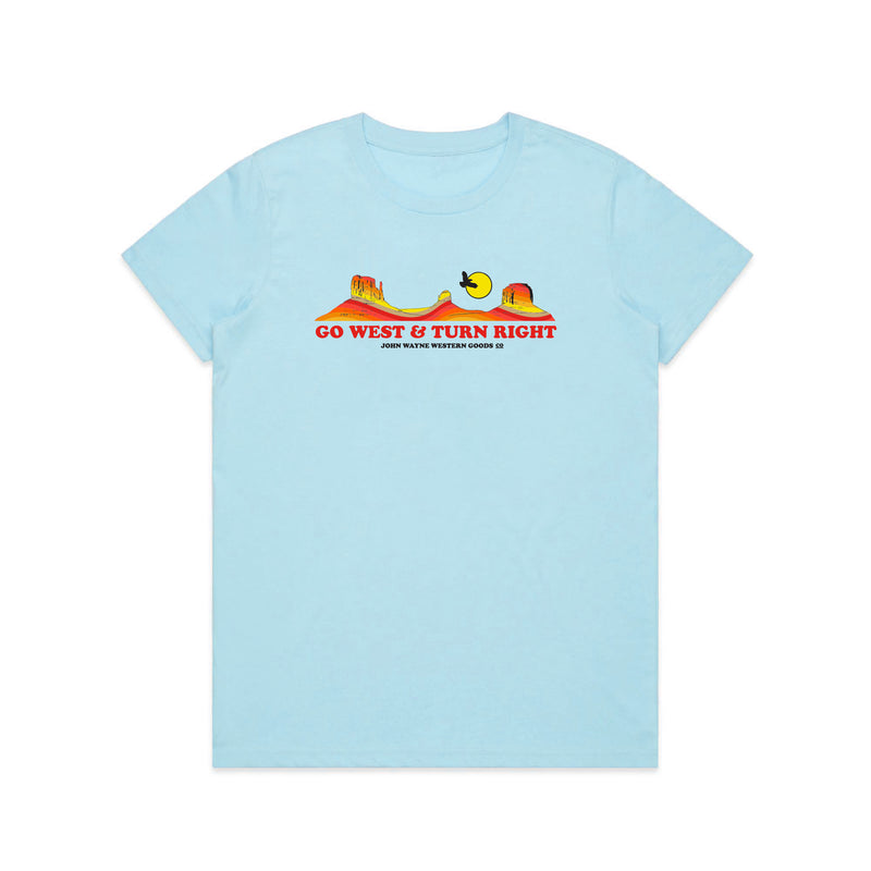front of blue womens t-shirt with desert scene and "go west & turn right" below it