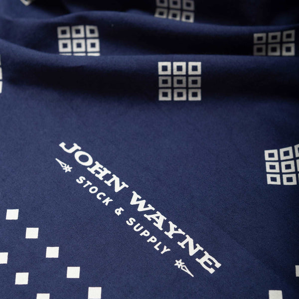 close up of john wayne logo on bandana 