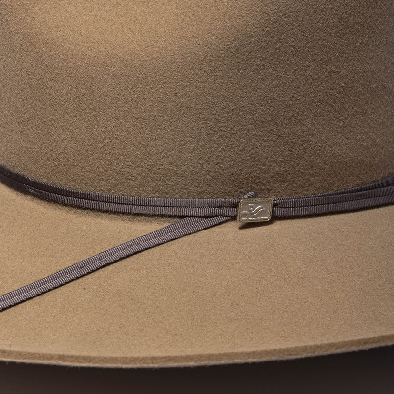 close up of custom john wayne pin on hat band