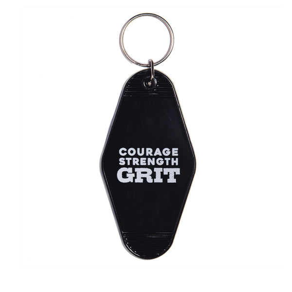 back of black keychain with "courage strength grit" in center 