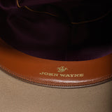close up of inside hat brim with john wayne initials 