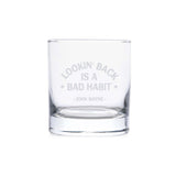 whiskey glass with "lookin' back is a bad habit" on it