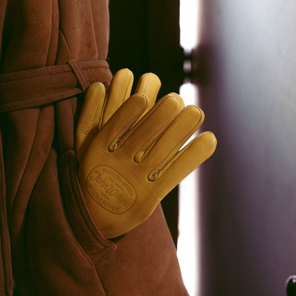 john wayne  work gloves poking out of coat pocket