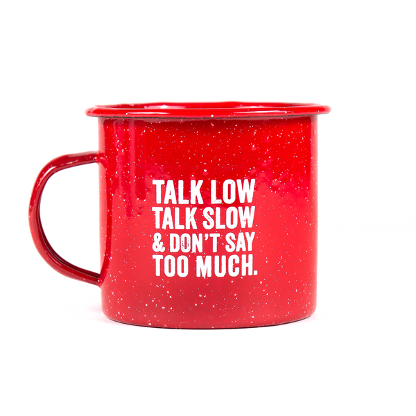 red tin mug with "talk low talk slow and don't say too much"