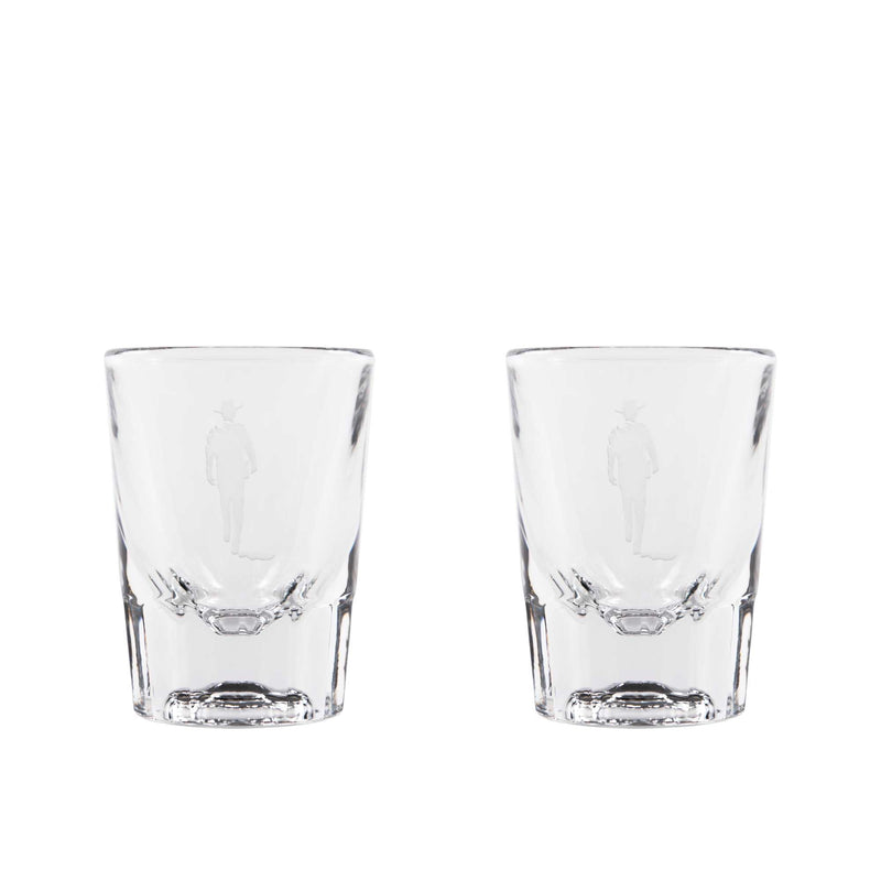 two shot glasses with sandblasted john wayne silhouette on them 