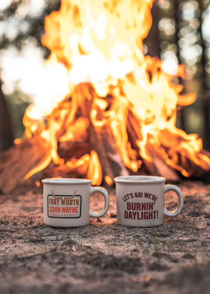 mug with "let's go! we're burnin' daylight!" in front of fire