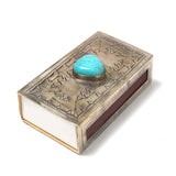 match box with turquoise stone on top