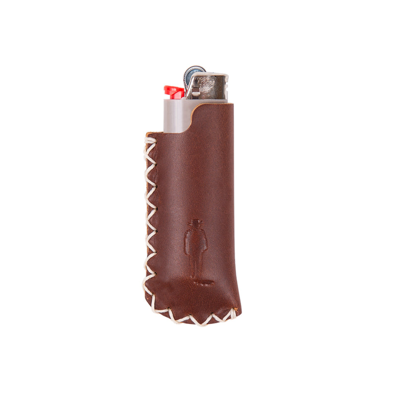 brown leather lighter cover with john wayne silhouette and hand sewn binding on lighter 