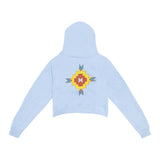 back of womens blue crop hoodie with yellow and orange tribal design