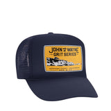 front of blue trucker hat with "john wayne grit series newport coast" and ocean scenery on it