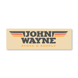 tan sticker with "john wayne stock & supply" with wings design