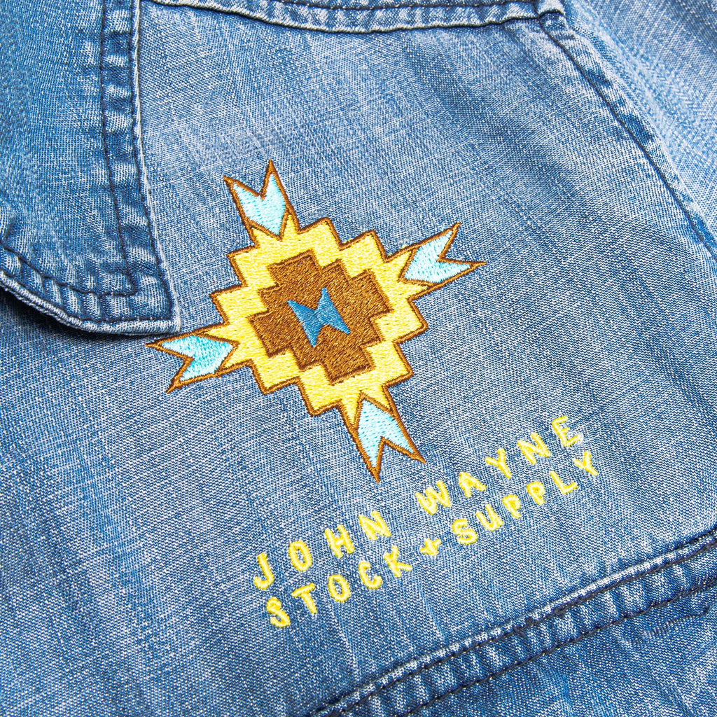 close up of orange and yellow tribal design on pocket