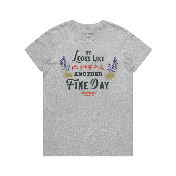front of grey women's t-shirt with "it looks like it's going to be another fine day" and two plants on either side of it